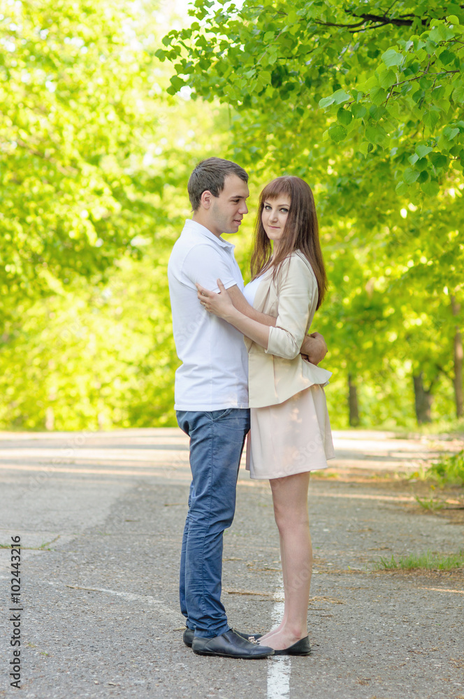 Hugging couple smiling side view Hugging couple smiling side view