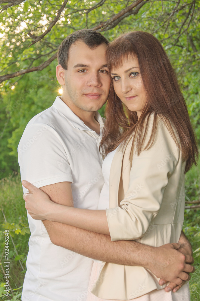 Happy young couple in love at the park. Happy young couple in love at the park.