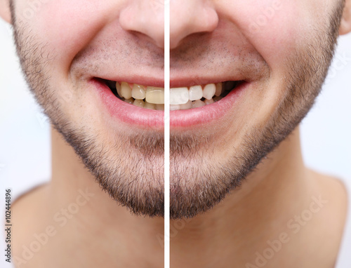 Smiling man isolated on whi...