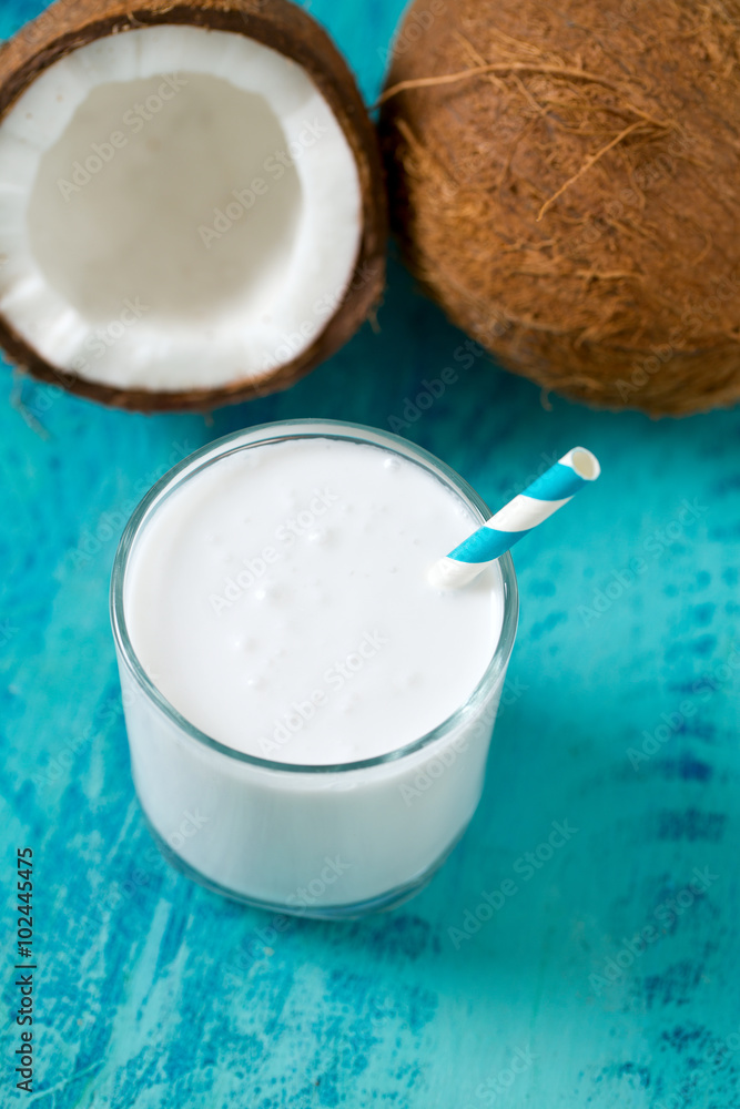 coconut milk on wooden surface coconut milk on wooden surface