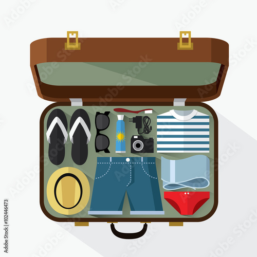 Packed suitcase for summer holiday