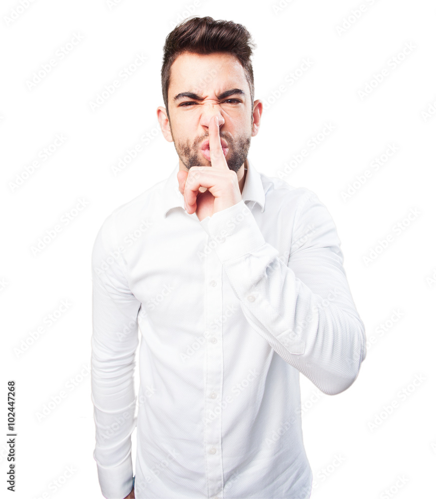 angry young man doing a silence gesture angry young man doing a silence gesture