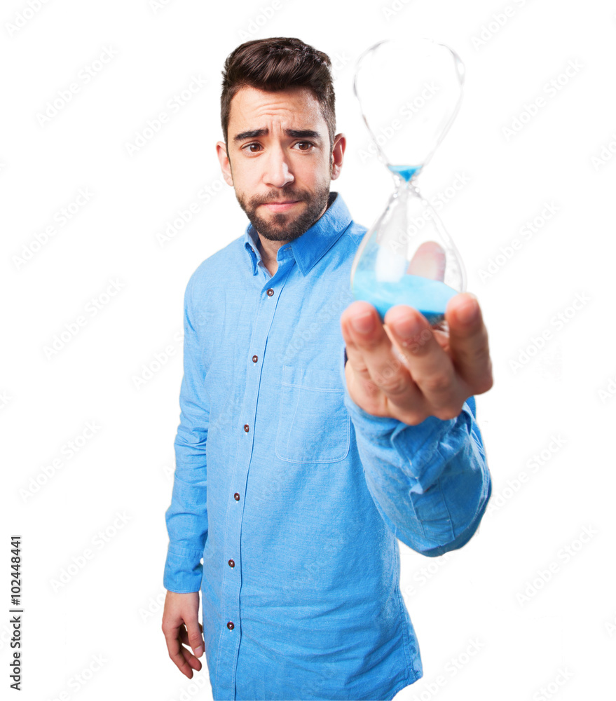 young man holding a sand timer