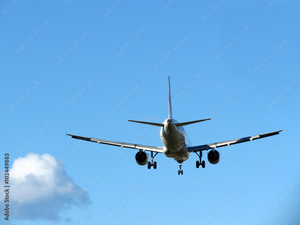  airplane taking off, against blue sky
