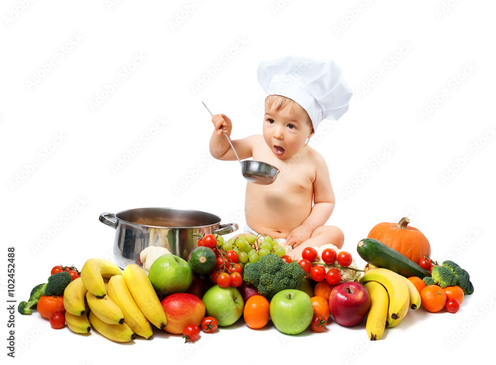 Baby boy in chef hat with cooking pan and vegetables Baby boy in chef hat with cooking pan and vegetables