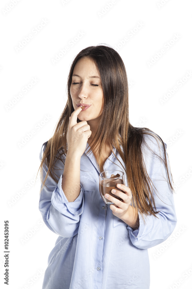 Young woman taking chocolate spread from a jar. Isolated on white background Young woman taking chocolate spread from a jar. Isolated on white background