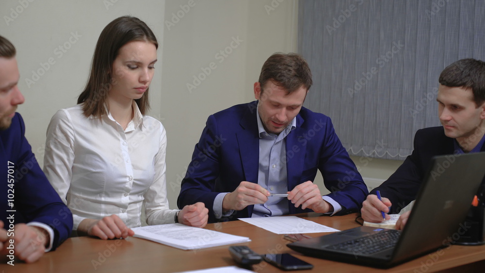 Two business people in elegant suits. Working in team together with documents sign up contract. Two business people in elegant suits. Working in team together with documents sign up contract.