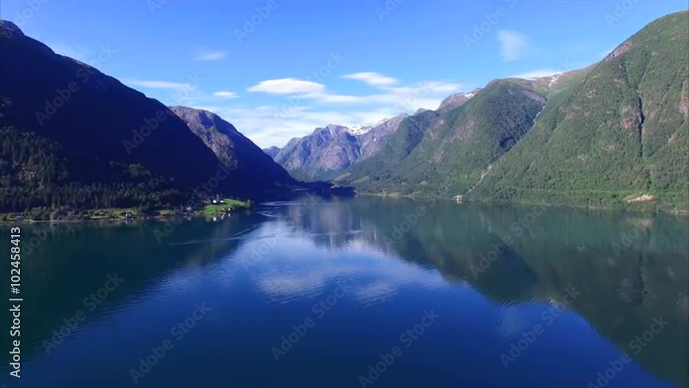 Tranquil scenery of calm fjord with mountains reflecting on the water surface, Sognefjorden in Norway. Aerial 4k Ultra HD. Tranquil scenery of calm fjord with mountains reflecting on the water surface, Sognefjorden in Norway. Aerial 4k Ultra HD.