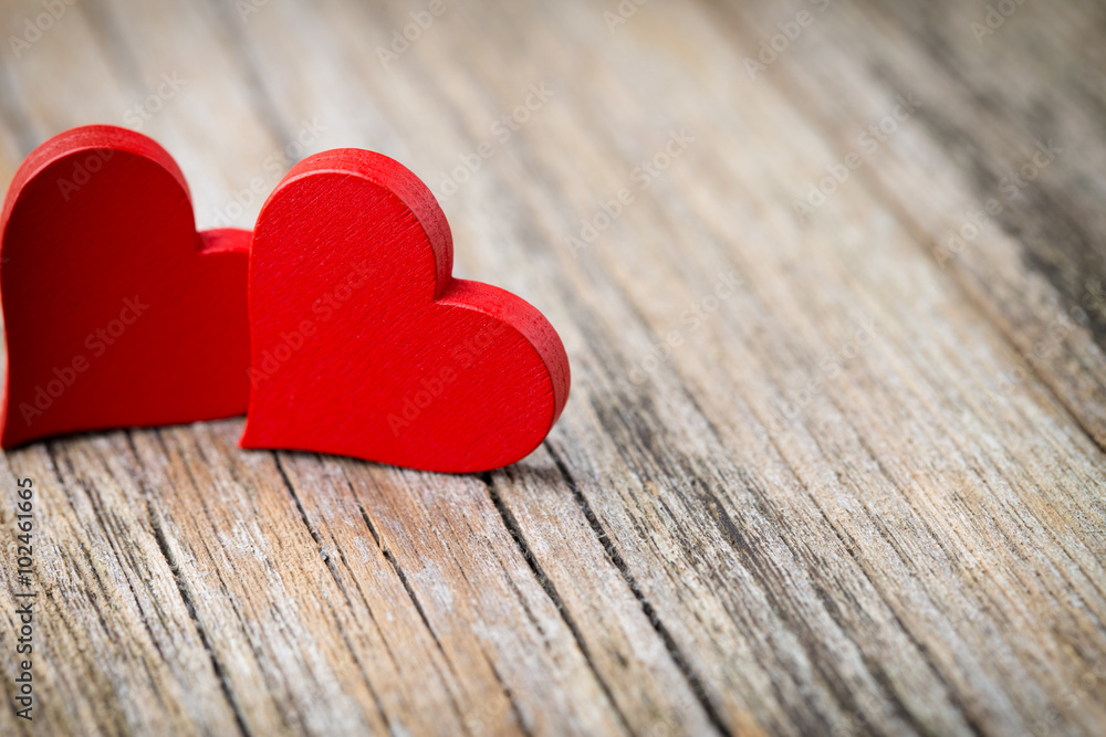 Red heart-shaped on a wooden background. Red heart-shaped on a wooden background.