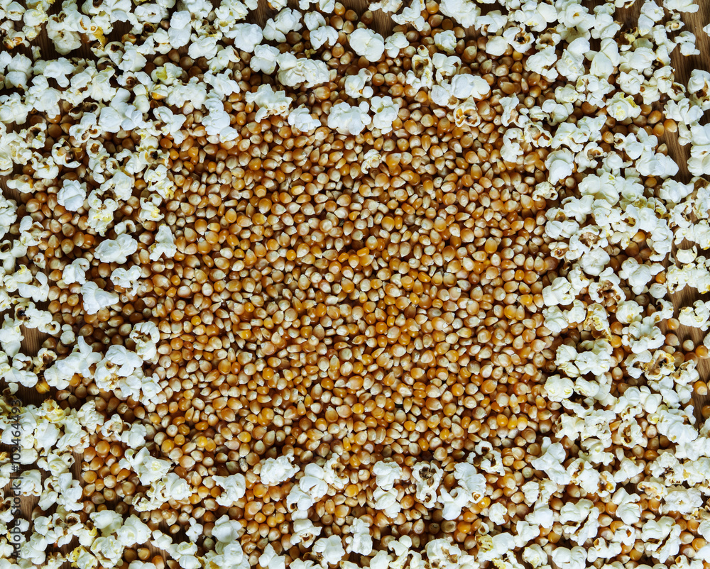 Popcorn background, with homemade popped and unpopped corn. Popcorn background, with homemade popped and unpopped corn.