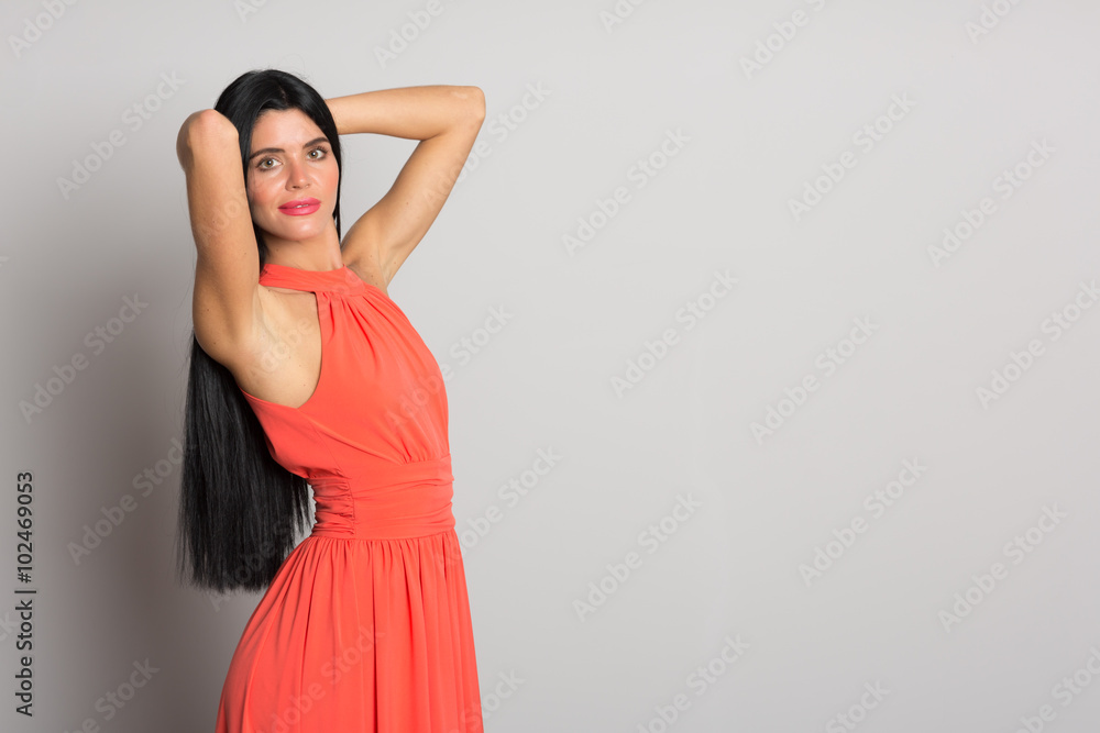Girl with black hair in orange dress Girl with black hair in orange dress