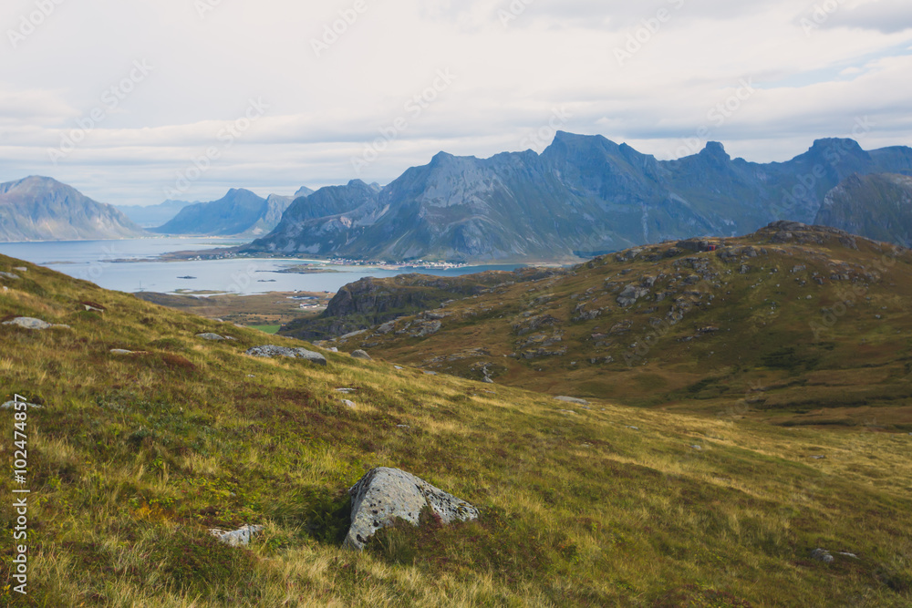 Classic norwegian scandinavian summer mountain landscape view with mountains, fjord, lake with a blue sky, Norway, Lofoten Islands Classic norwegian scandinavian summer mountain landscape view with mountains, fjord, lake with a blue sky, Norway, Lofoten Islands