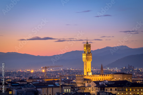 Beautiful evening view after sunset over the panorama of Florence, Tuscany (Italy), with Palazzo Vecchio (The Old Palace), with a dark vignette