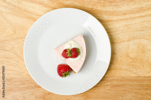 Homemade strawberry cheesecake  on white plate