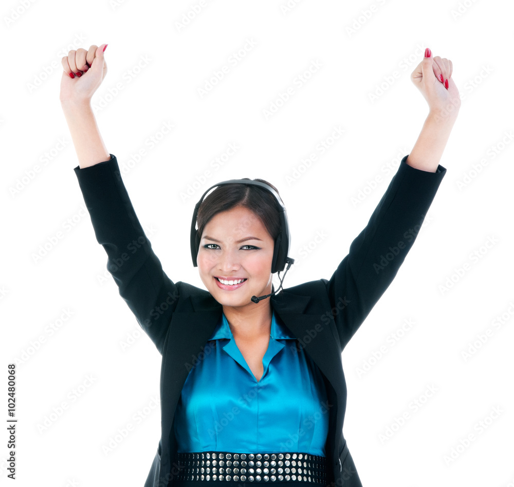 © iPortret - Young businesswoman with headset celebrating success
