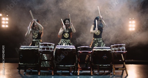 4K, very epic performance of Japanese Taiko drummers on stage, various rhythm and movement, slow motion photo