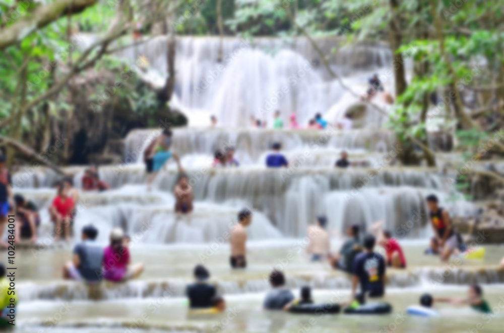 blurred many people and waterfall