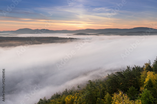 dense morning fog in south ural mountains during autumn