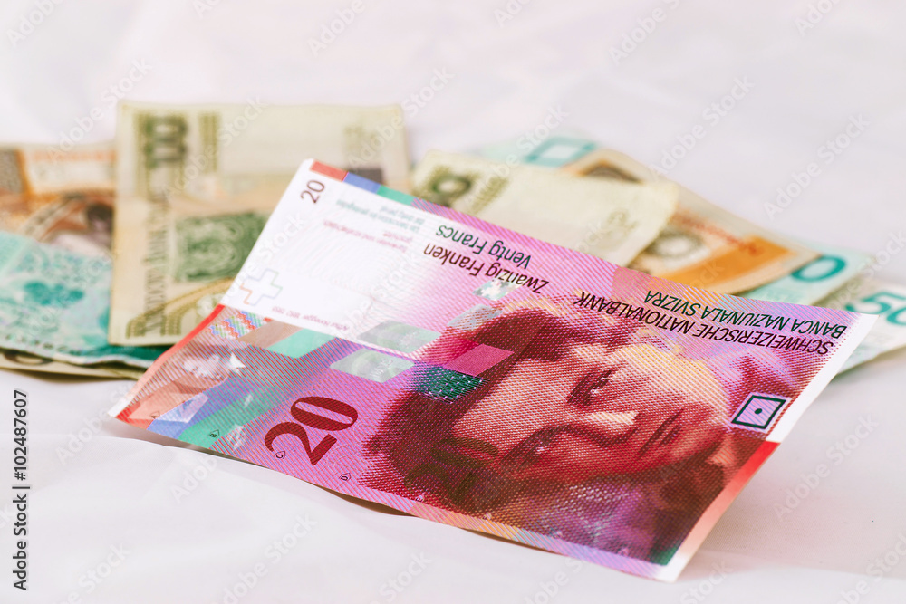 Obraz premium Swiss franc banknotes and Polish