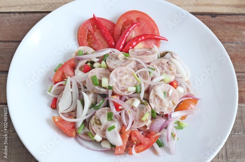Quadro em tela Thai Cuisine : Spicy Thai Sour Sausage with salad