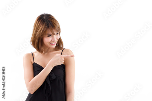 happy, smiling woman pointing sideways