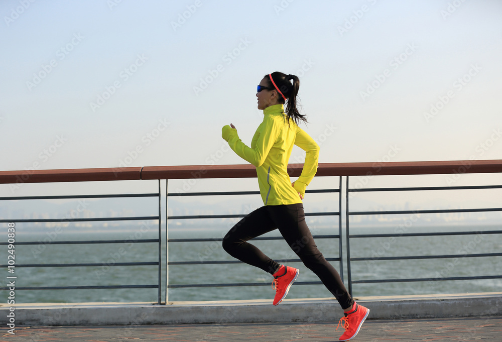 young fitness woman runner running on seaside young fitness woman runner running on seaside