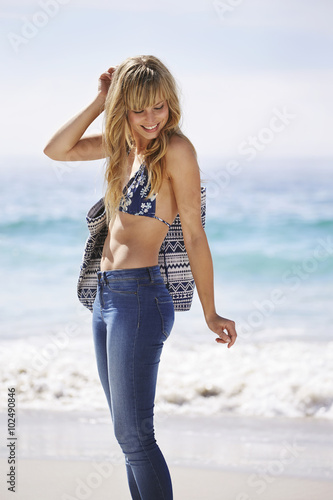 Slika na platnu Blond beauty in bikini top, looking down