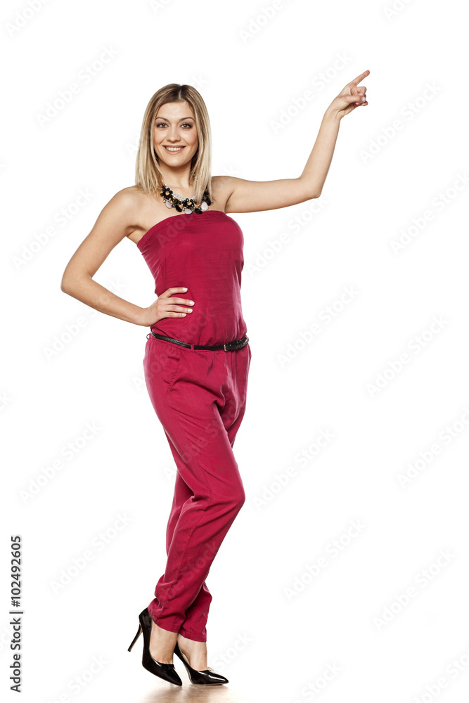 elegant pretty blonde pointing to empty space