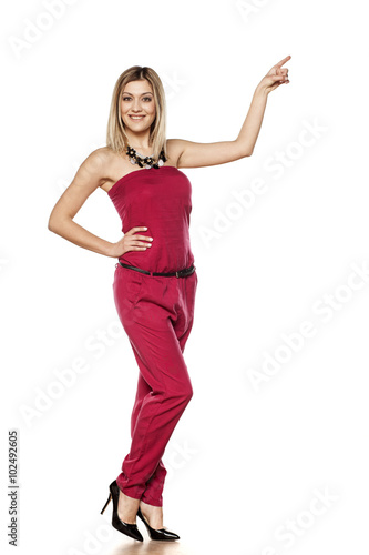 elegant pretty blonde pointing to empty space