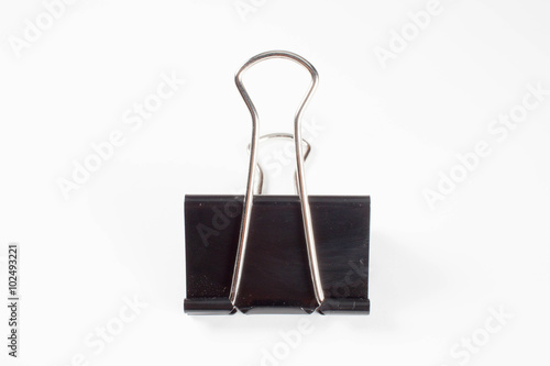 Spring paper clip against a plain white background
