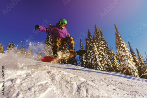 Snowboarder jumping