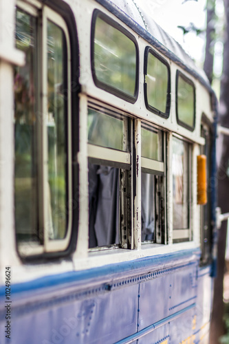 Thai bus with the windows open at the station