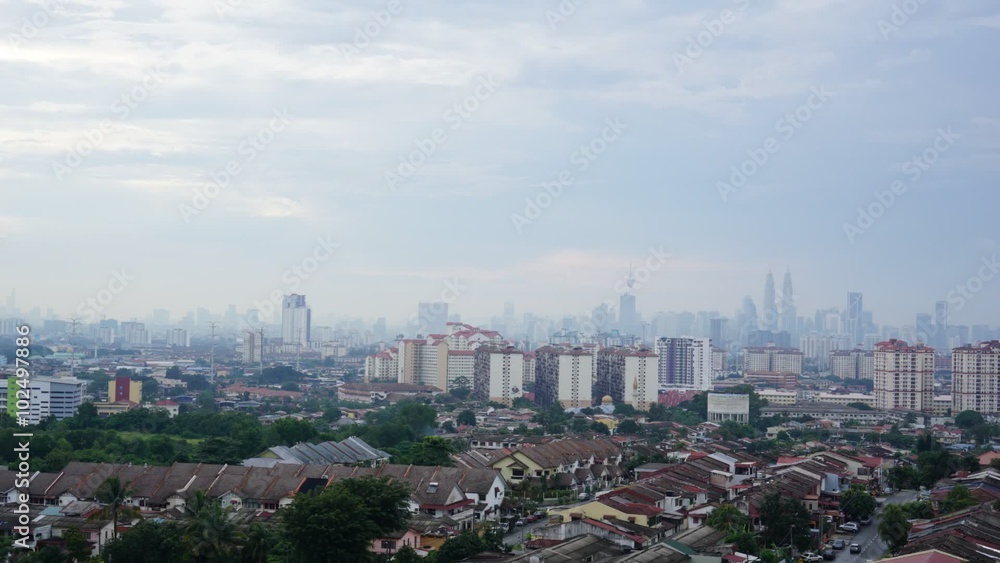Time lapse view of downtown Kuala Lumpur, Malaysia with Petronas Twin Towers as the highest peak in the middle of it. Time lapse view of downtown Kuala Lumpur, Malaysia with Petronas Twin Towers as the highest peak in the middle of it.