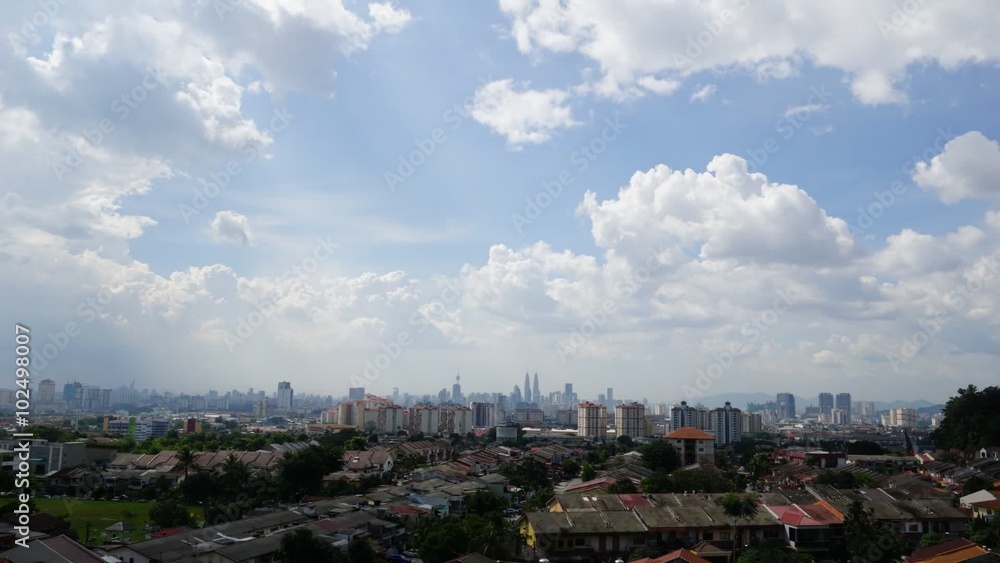 Time lapse view of downtown Kuala Lumpur, Malaysia with Petronas Twin Towers as the highest peak in the middle of it. Time lapse view of downtown Kuala Lumpur, Malaysia with Petronas Twin Towers as the highest peak in the middle of it.