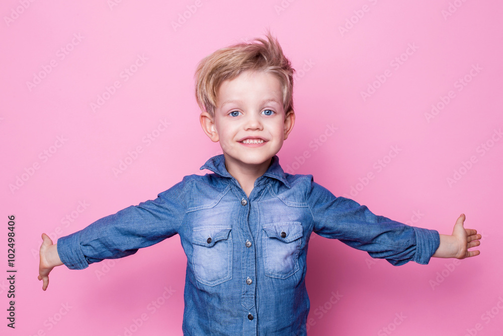 Portrait of happy joyful beautiful little boy. Studio portrait over pink background Portrait of happy joyful beautiful little boy. Studio portrait over pink background