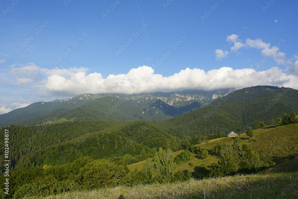 Obraz premium Evening and sunset on mountain hills of Simon village. Bran. RomaniaEvening and sunset on mountain hills of Simon village. Bran. Romania