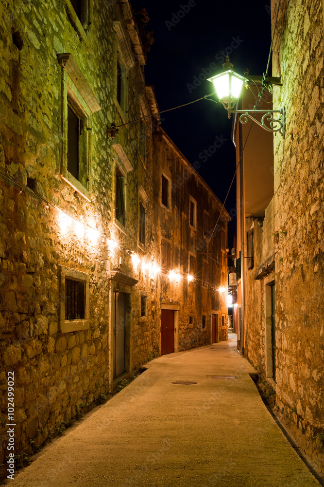 Mediterranean alley in a small town at night