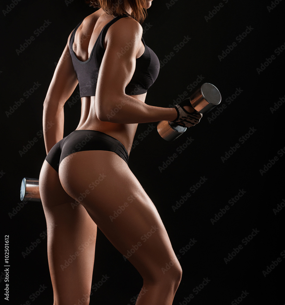She is an artwork. Cropped shot of a strong and toned fitness woman posing in studio She is an artwork. Cropped shot of a strong and toned fitness woman posing in studio