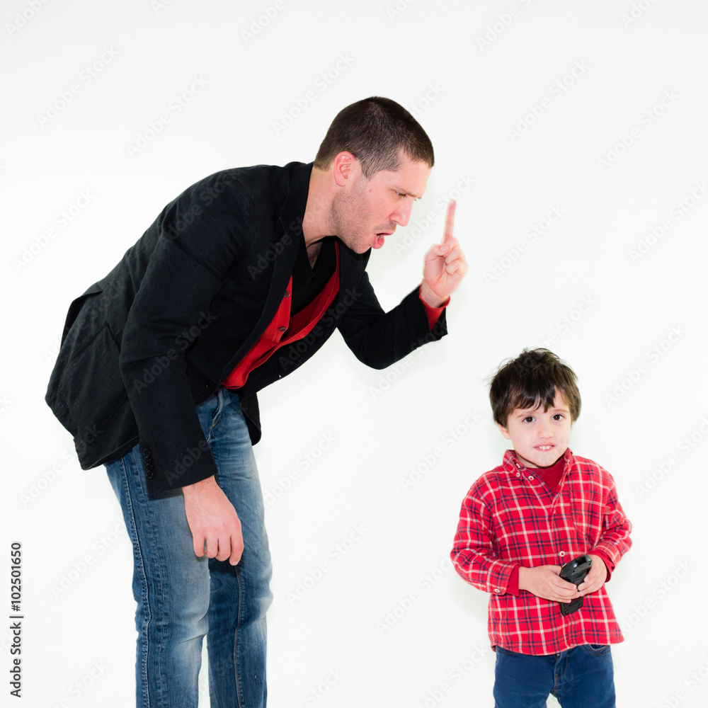 portrait of angry father scolding his son pointing finger, isolated on ...