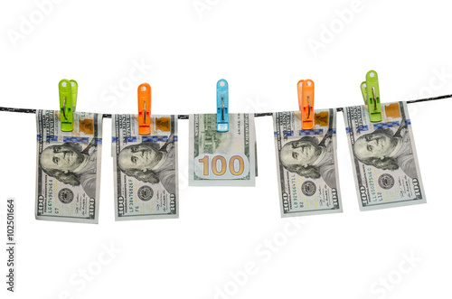 one hundred us dollars are drying on cord isolated on white background photo