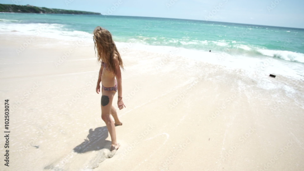 beautiful young girl on the beach is happy beautiful young girl on the beach is happy