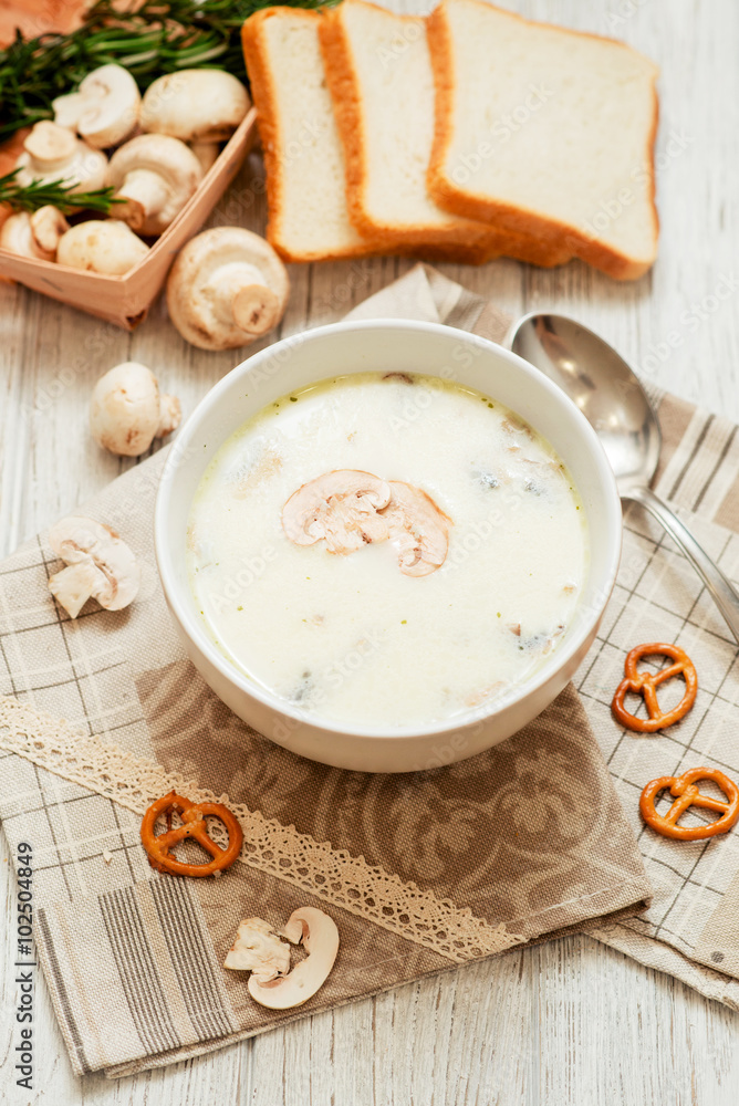 mushroom soup with potatoes , carrots , green and white toast on a wooden background
mushroom soup with potatoes , carrots , green and white toast on a wooden background