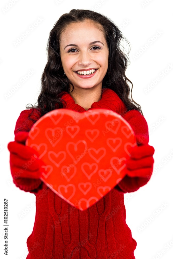 Smiling woman holding heart shape box Smiling woman holding heart shape box