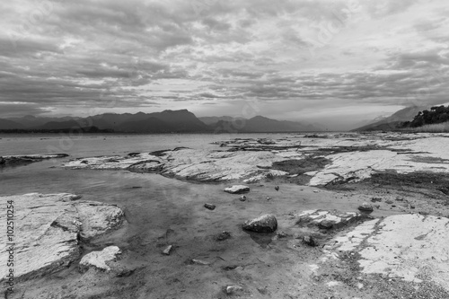 scenic lake landscape at sunset in black and white. Long exposure