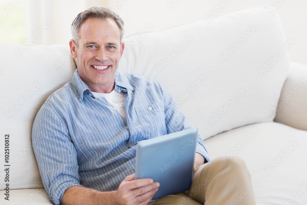 Happy man using tablet computer Happy man using tablet computer
