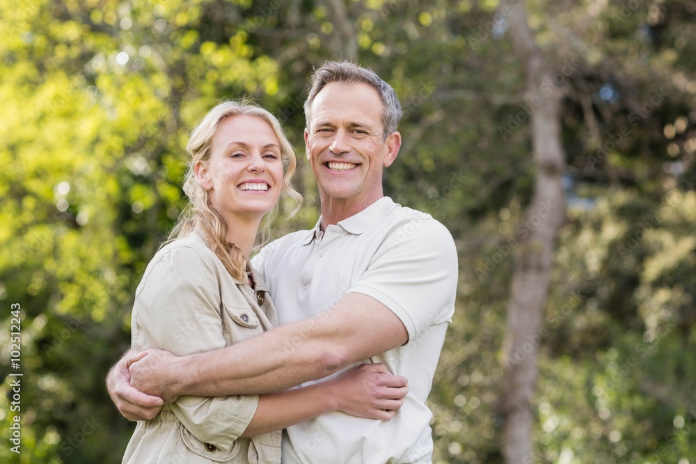 Cute couple hugging with arms around Cute couple hugging with arms around