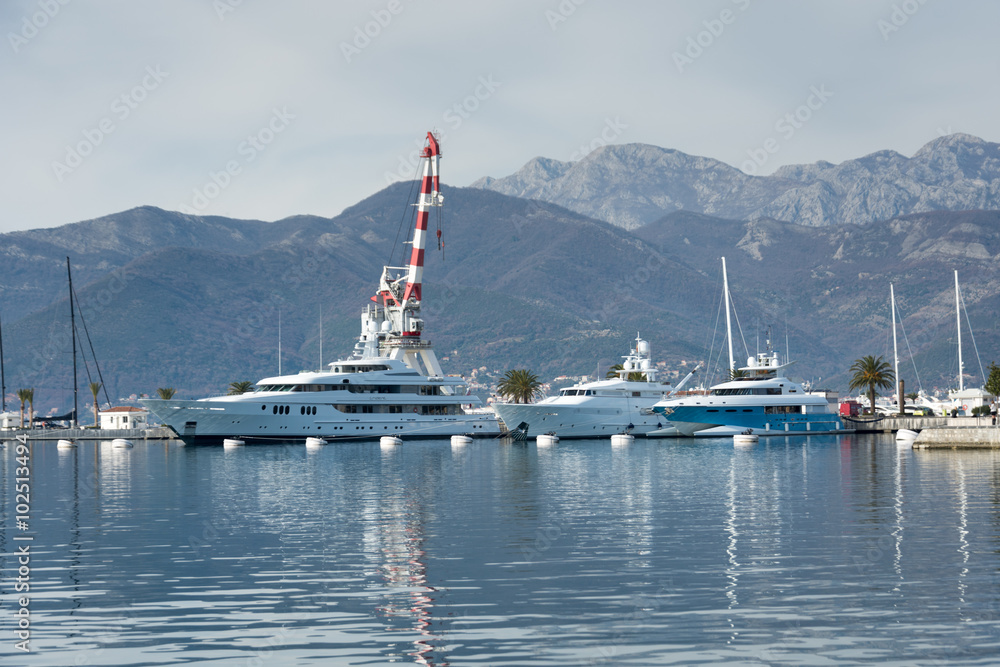 Naklejka premium Port of montenegro with yachts and moving sky and clouds