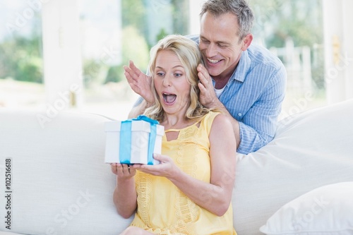 Husband surprising wife with a present