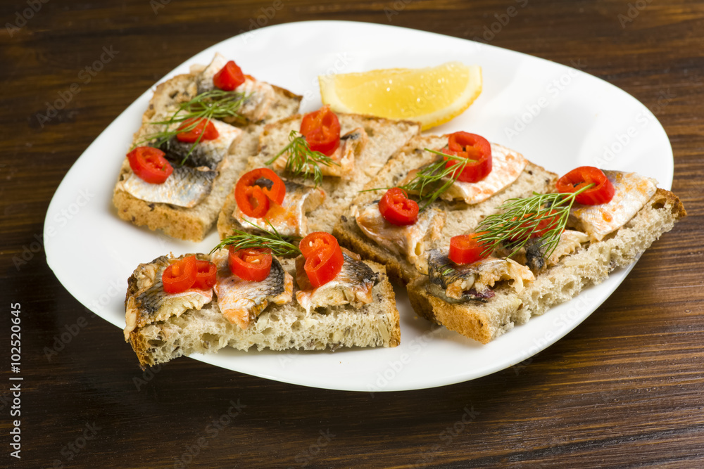 sandwiches with herring, red pepper and dill
