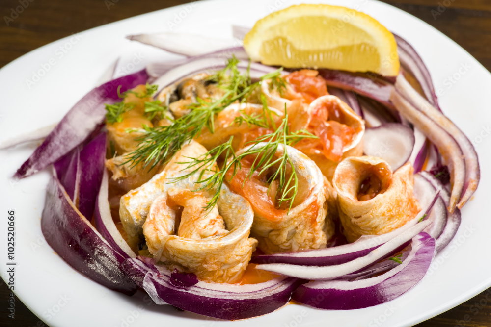 Herring rolls in oil and onions Herring rolls in oil and onions
